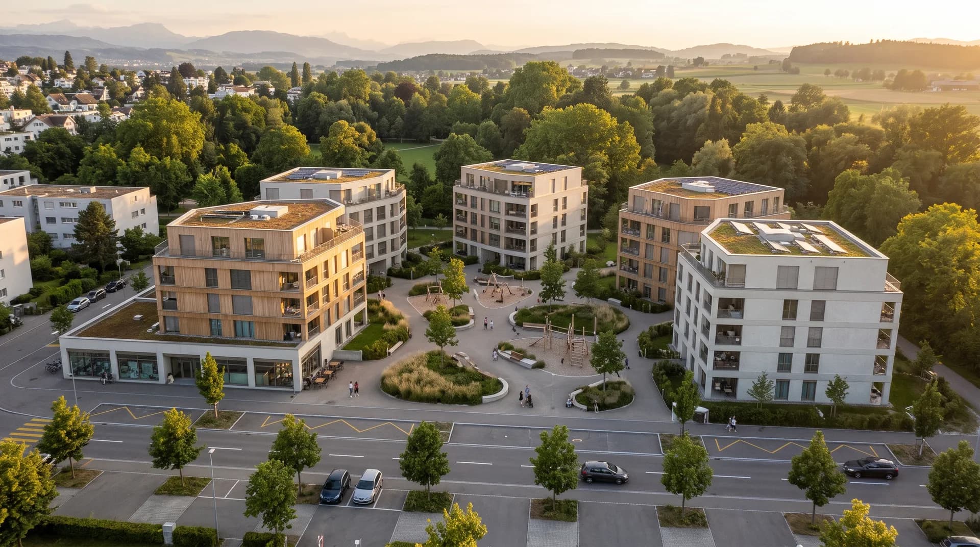 Ensemble da chasas da pliras famiglias cun plazza da quartier en la glisch da la saira – visualisà, da primavaira e da notg.